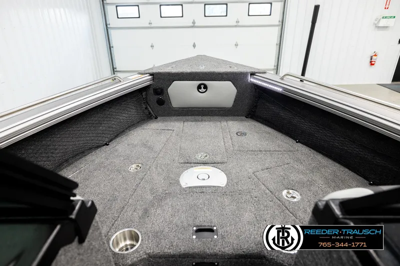 Slide: The Image of 2026 Lund 1875 Tyee boat interior with carpeted deck and storage compartments. - 14