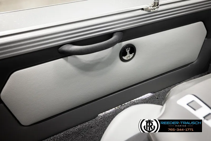 Slide: The Image of 2026 Lund 1875 Tyee interior detail with handle and latch, Reeder-Trausch Marine branding. - 23