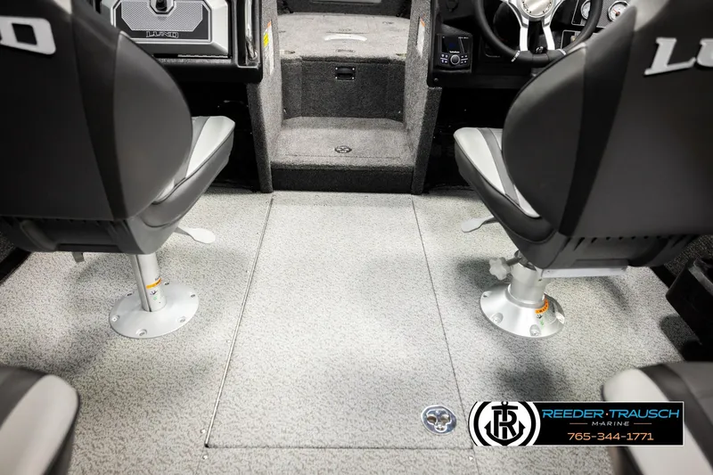 Slide: The Image of 2026 Lund 1875 Tyee boat interior with two swivel seats and carpeted flooring. - 29
