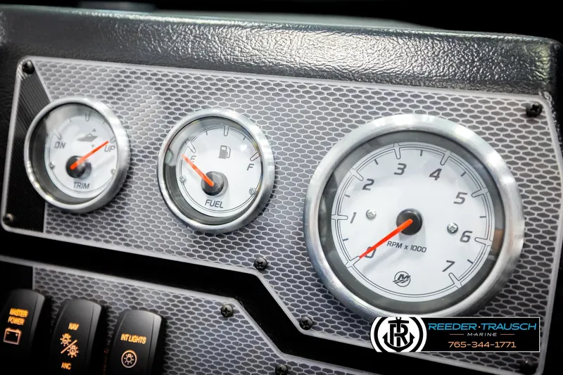 Slide: The Image of Dashboard of 2026 Lund 1875 Tyee boat with trim, fuel, and RPM gauges. - 37