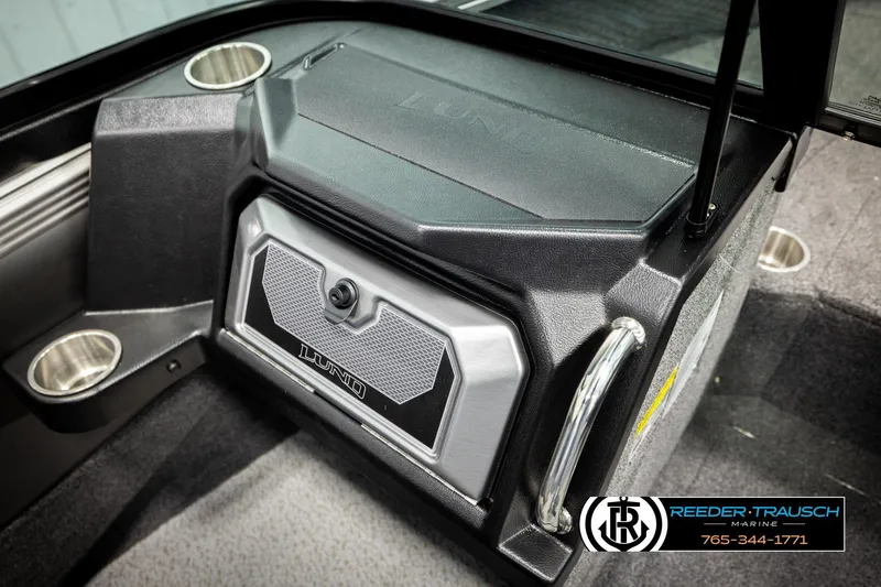 Slide: The Image of 2026 Lund 1875 Tyee boat interior with storage compartment and cup holders. - 41