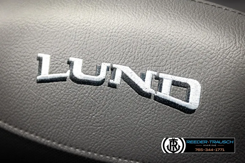 Slide: The Image of Close-up of Lund logo on 2026 Lund 1875 Tyee boat seat. - 46