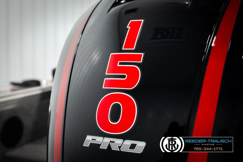 Slide: The Image of Close-up of a 2026 Lund 1875 Tyee boat engine with "150 Pro" branding. - 51