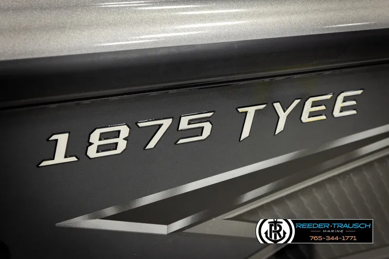 Slide: The Image of 2026 Lund 1875 Tyee boat model nameplate with Reeder-Trausch Marine logo. - 56