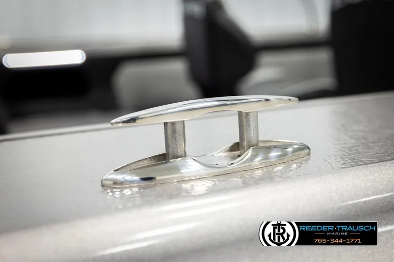 Slide: The Image of 2026 Lund 1875 Tyee boat cleat detail, Reeder-Trausch Marine branding visible. - 58