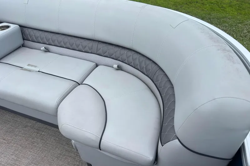 Slide: The Image of 2019 Ranger Reata 200C boat seating with gray upholstery and diamond stitching detail. - 21