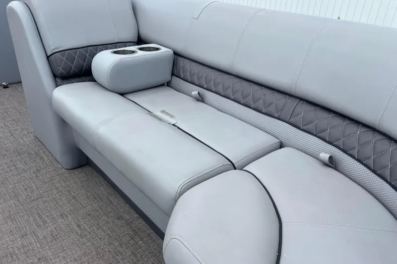 Slide: The Image of 2019 Ranger Reata 200C boat interior with gray cushioned seating and cup holders. - 23