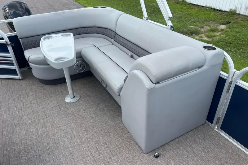 Slide: The Image of 2019 Ranger Reata 200C boat interior with gray seating and table. - 28