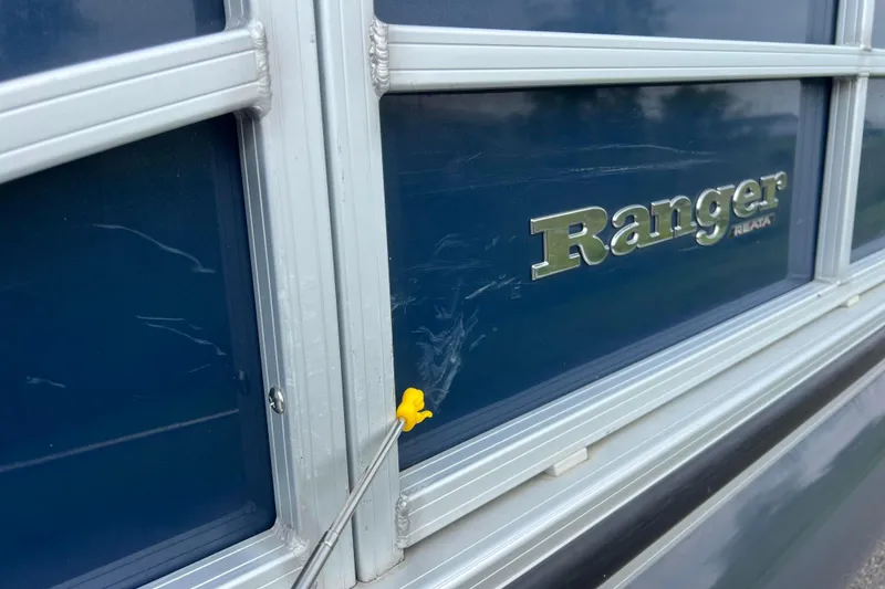 Slide: The Image of 2019 Ranger Reata 200C boat with blue exterior and silver logo detailing. - 36