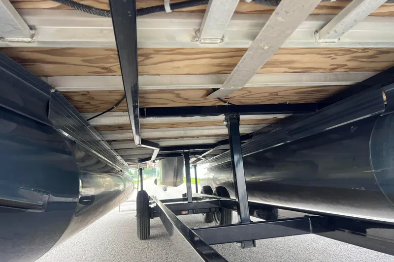 Slide: The Image of Underside view of a 2019 Ranger Reata 200C pontoon boat on a trailer. - 39