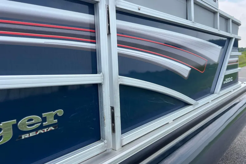 Slide: The Image of 2019 Ranger Reata 200C boat side view with sleek design and logo. - 41