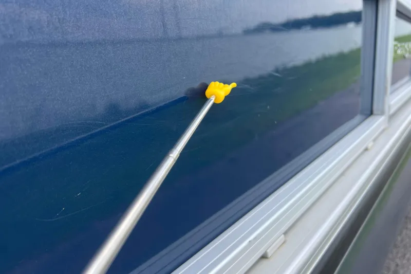 Slide: The Image of Yellow pointer on blue Ranger Reata 200C, 2019 model, near window. - 51