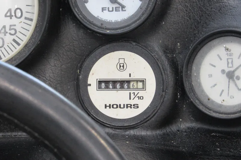 Slide: The Image of Close-up of 1996 Nautique Ski 196 boat hour meter showing 466.6 hours. - 9