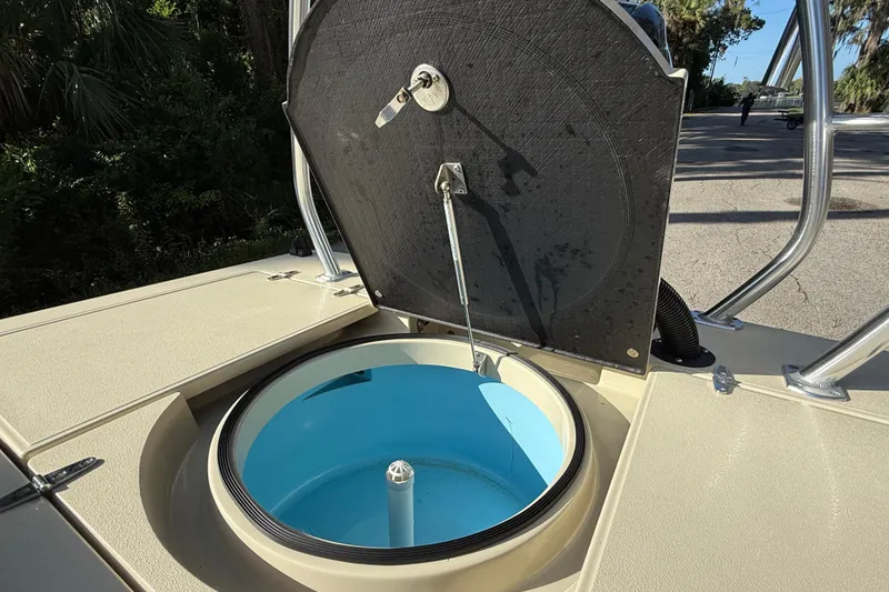 Slide: The Image of 2020 East Cape EVO X 18 boat livewell with open lid, showcasing interior design. - 10