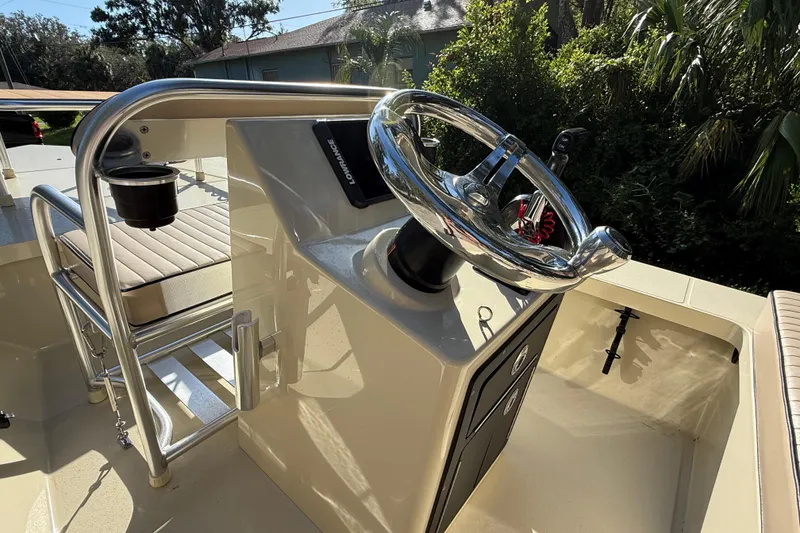 Slide: The Image of 2020 East Cape EVO X 18 boat console with steering wheel and seating. - 12