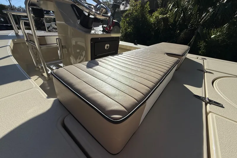 Slide: The Image of 2020 East Cape EVO X 18 boat interior with cushioned seating and steering console. - 13