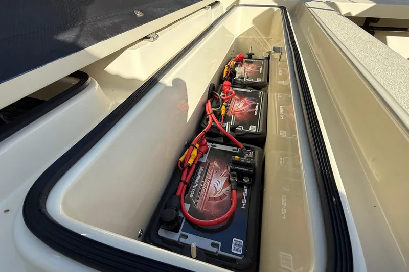 Slide: The Image of Battery compartment of 2020 East Cape EVO X 18 boat with neatly arranged batteries. - 14
