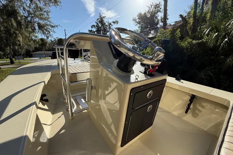 Slide: The Image of 2020 East Cape EVO X 18 boat console with steering wheel, outdoor setting. - 15