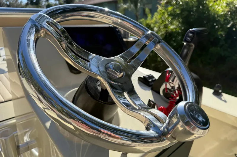 Slide: The Image of Steering wheel of 2020 East Cape EVO X 18 boat, close-up view. - 16
