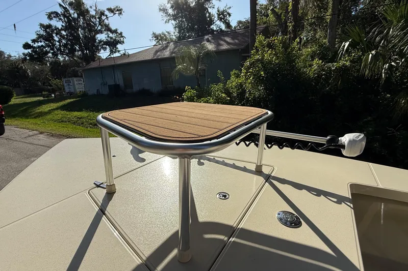 Slide: The Image of 2020 East Cape EVO X 18 boat with elevated casting platform in a sunny outdoor setting. - 20