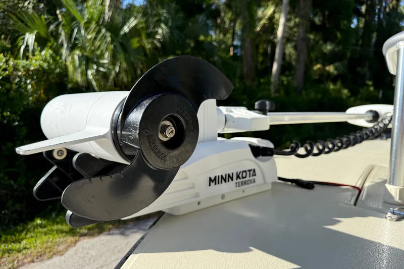 Slide: The Image of Minn Kota Terrova motor on 2020 East Cape EVO X 18 boat, surrounded by lush greenery. - 27