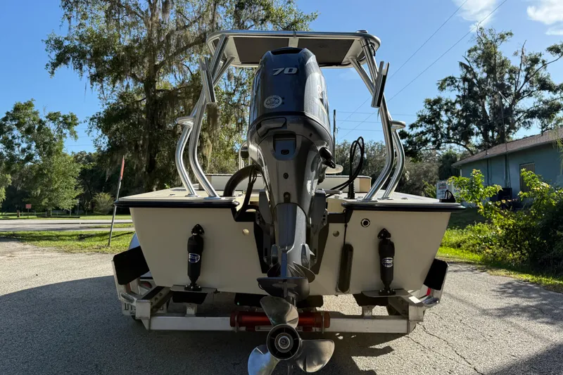 Slide: The Image of East Cape EVO X 18 boat, 2020 model, with outboard motor on trailer. - 5