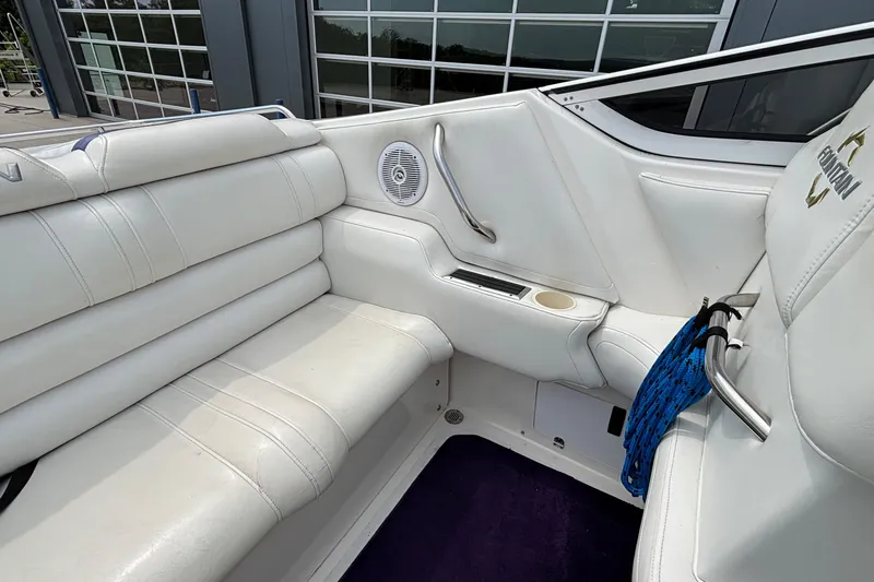 Slide: The Image of 2003 Fountain 29 Fever boat interior with white leather seating and speaker. - 10