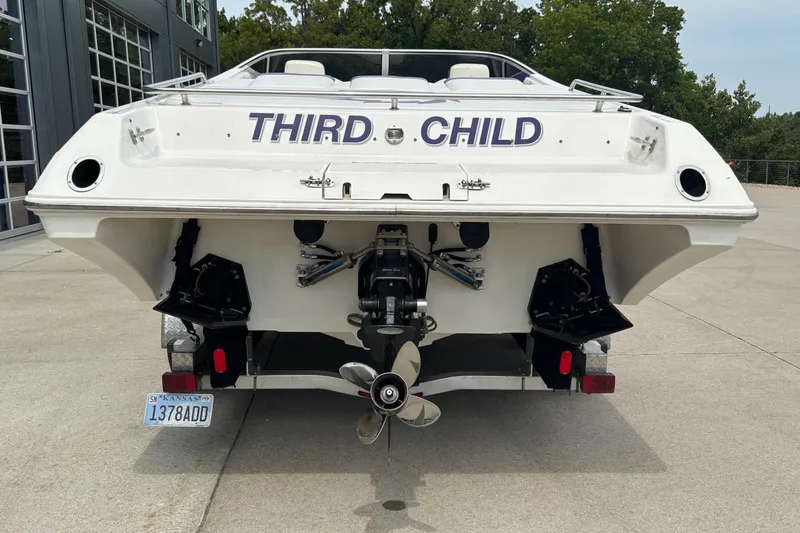 Slide: The Image of Rear view of 2003 Fountain 29 Fever boat named "Third Child" with Kansas license plate. - 14