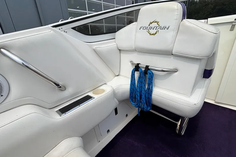 Slide: The Image of 2003 Fountain 29 Fever boat interior with white seating and blue rope. - 16