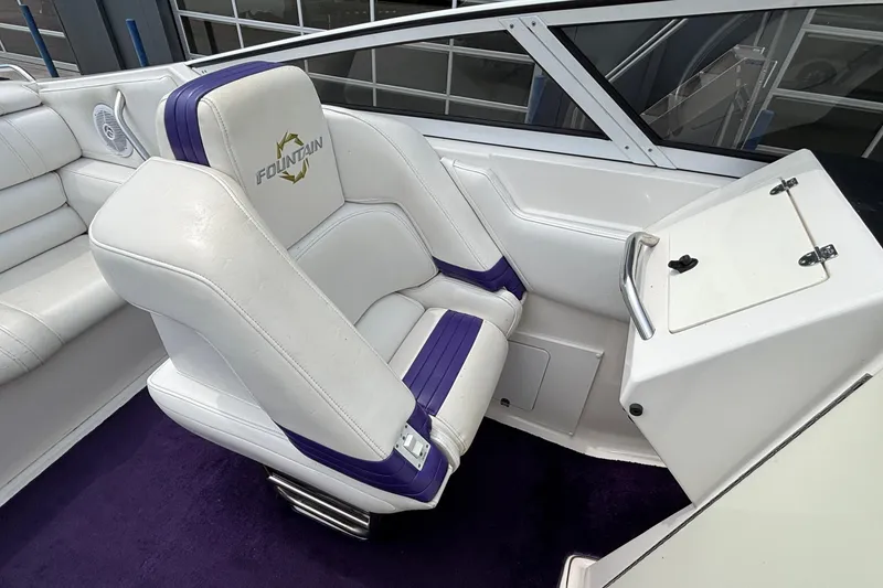 Slide: The Image of 2003 Fountain 29 Fever boat interior with white and purple seating. - 20