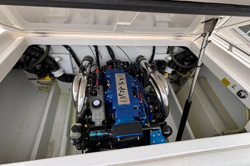 Slide: The Image of 2003 Fountain 29 Fever boat engine compartment with blue EFI engine. - 28