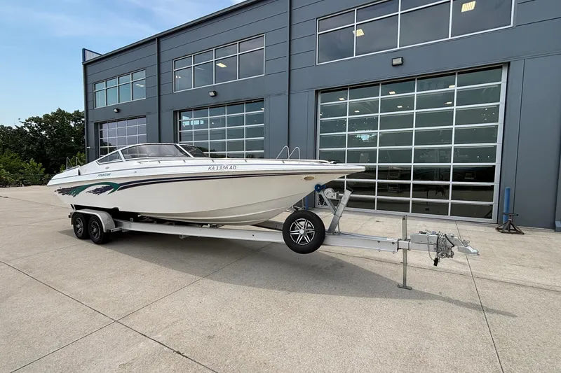 Slide: The Image of 2003 Fountain 29 Fever boat on trailer outside modern building. - 5