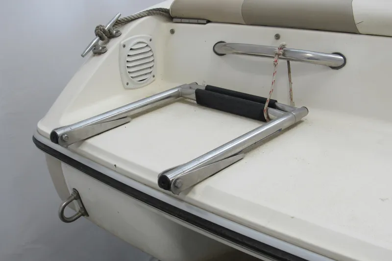 Slide: The Image of 2001 Stingray 180 LS/LX boat swim platform with foldable ladder and anchor rope. - 10