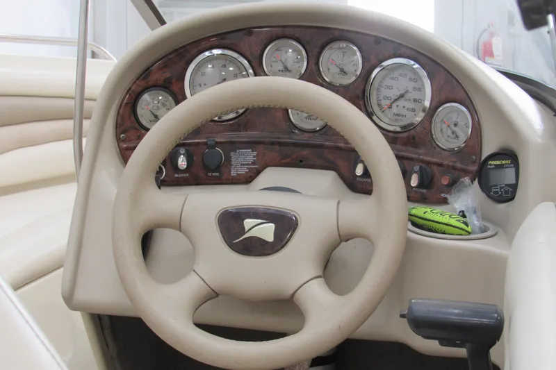 Slide: The Image of 2001 Stingray 180 LS/LX boat dashboard with gauges and steering wheel. - 3