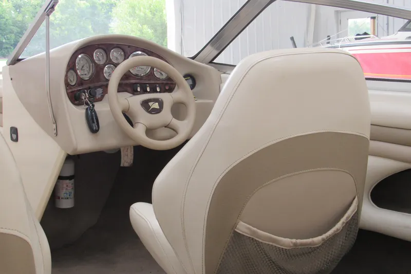 Slide: The Image of 2001 Stingray 180 LS/LX boat interior with steering wheel and dashboard controls. - 4
