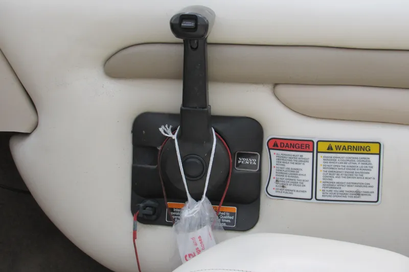 Slide: The Image of 2001 Stingray 180 LS/LX boat throttle control with Volvo Penta branding and safety warnings. - 9
