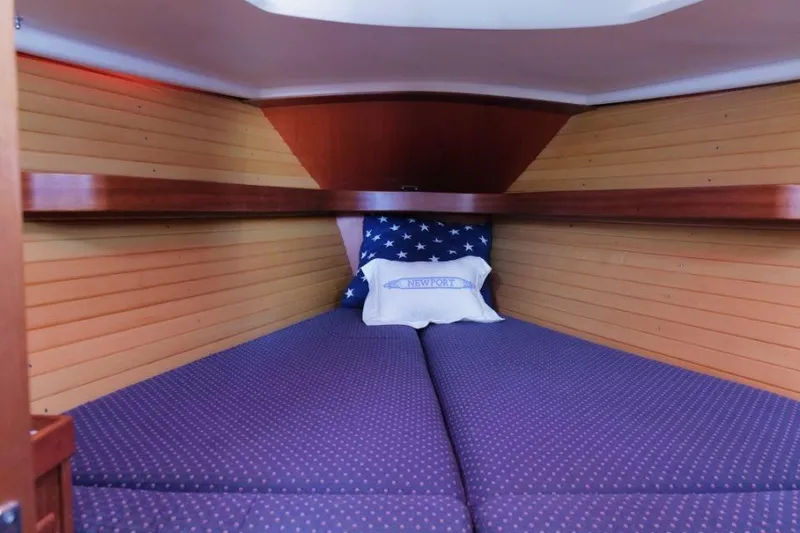 Slide: The Image of Cozy cabin interior of 2002 Sabre 362 sailboat with star-patterned pillows. - 6