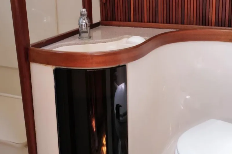 Slide: The Image of Luxurious bathroom interior of 2002 Sabre 362 yacht with wooden accents and modern fixtures. - 7