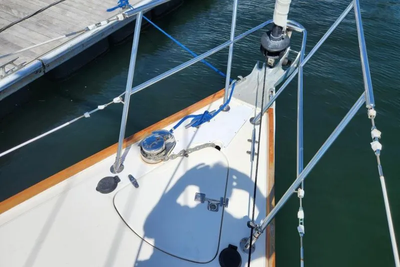 Slide: The Image of Bow of 2002 Sabre 362 sailboat docked, featuring rigging and deck details. - 8