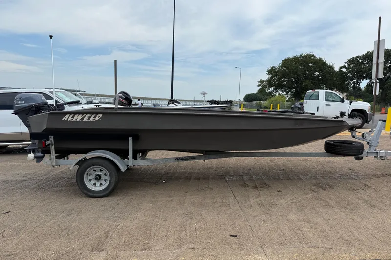 Slide: The Image of 2021 Alweld 1852 Invader boat on trailer at a parking area. - 18