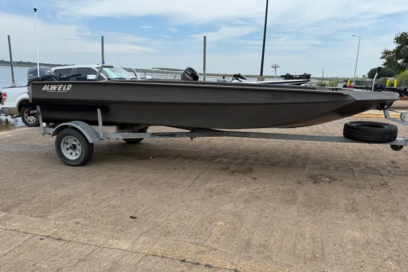 Slide: The Image of 2021 Alweld 1852 Invader boat on trailer at lakeside launch. - 19