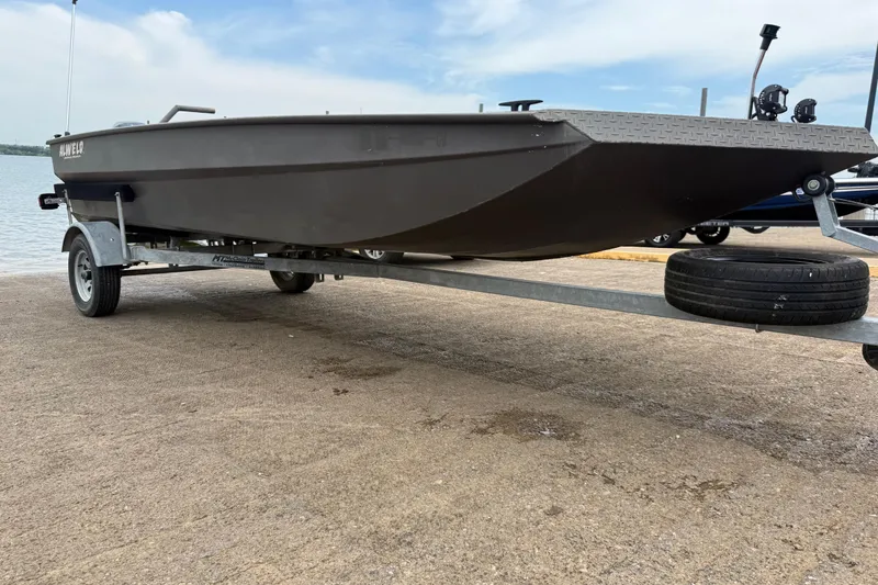 Slide: The Image of 2021 Alweld 1852 Invader boat on trailer by the water. - 20