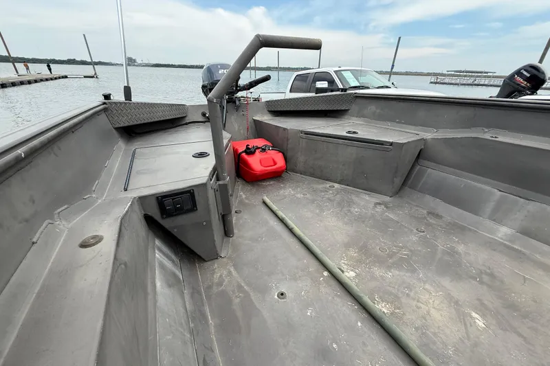 Slide: The Image of 2021 Alweld 1852 Invader boat interior with red fuel tank and lake view. - 25