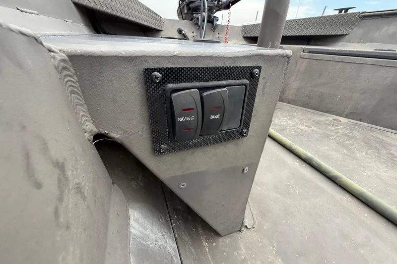 Slide: The Image of 2021 Alweld 1852 Invader boat interior with navigation and bilge switches. - 26