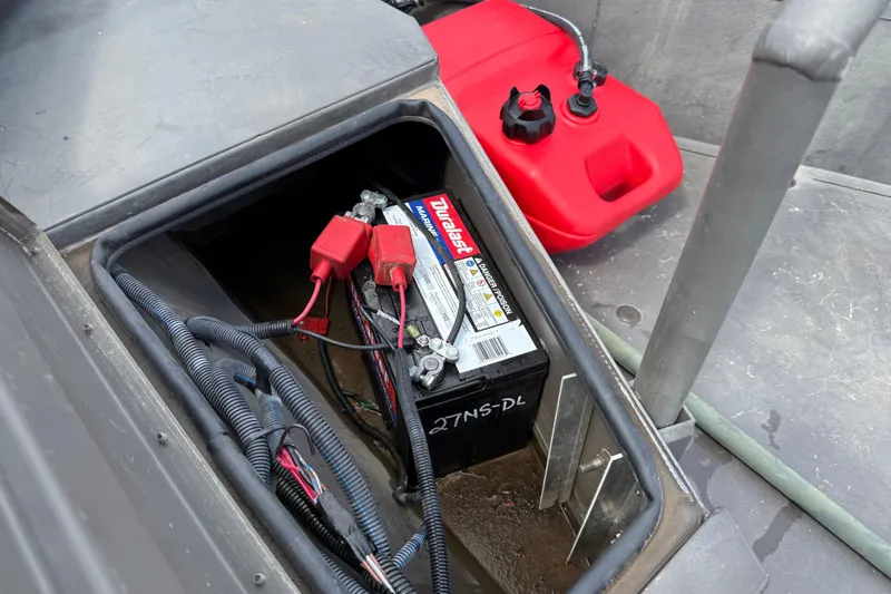 Slide: The Image of 2021 Alweld 1852 Invader boat battery compartment with marine battery and fuel tank. - 28