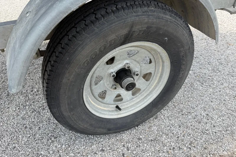 Slide: The Image of Trailer wheel of a 2021 Alweld 1852 Invader on gravel surface. - 29