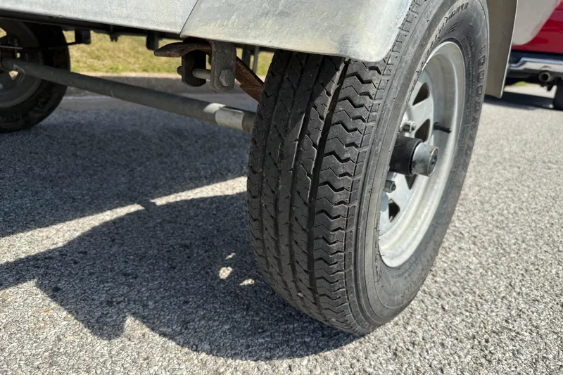 Slide: The Image of Close-up of a 2021 Alweld 1852 Invader trailer tire on asphalt. - 32
