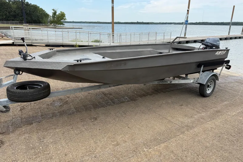 Slide: The Image of 2021 Alweld 1852 Invader boat on trailer by a lakeside dock. - 5