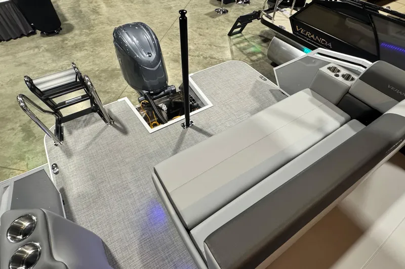 Slide: The Image of 2026 Veranda Relax VR235VL pontoon boat with seating, motor, and cup holders. - 10