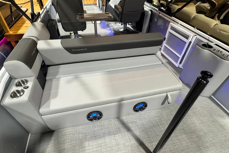 Slide: The Image of 2026 Veranda Relax VR235VL pontoon boat interior with gray seating and cup holders. - 11